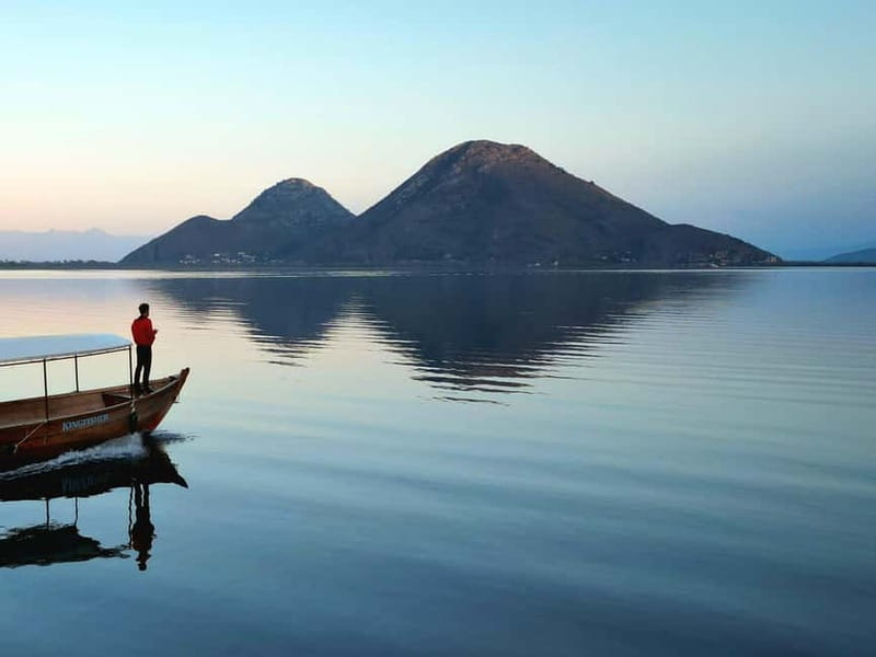 Skadar Lake: Guided Sunset Boat Tour with Wooden Boat & Wine - Wine, juice, and guide stories that actually connect things